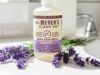 Mrs Meyers Clean Day Hand Soap Refill Lavender bottle placed with fresh lavender flowers