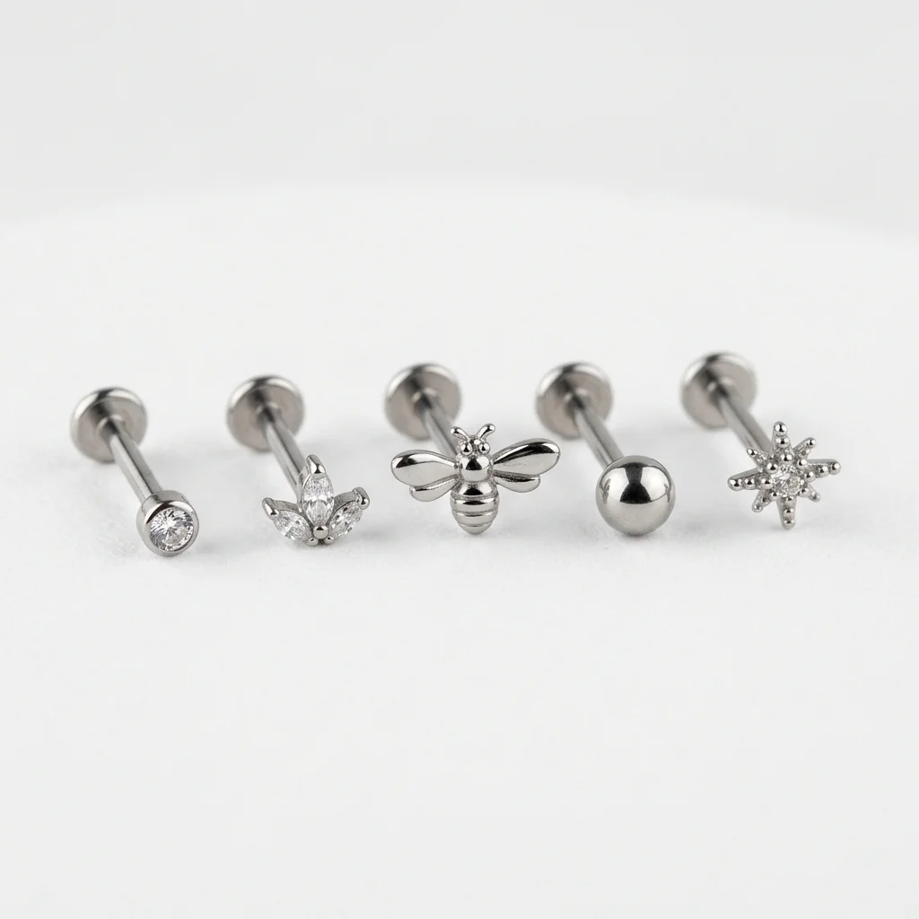 Implant grade titanium flat back studs for helix piercings